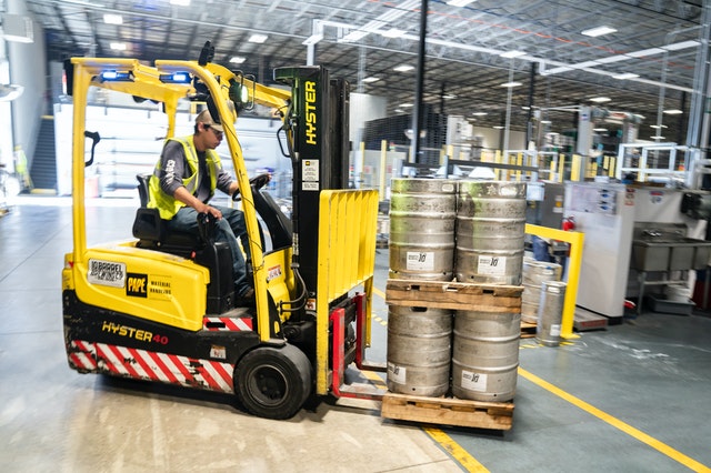 person driving a forklift